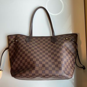 Authentic. Original dust bag included. No cracks or tears.